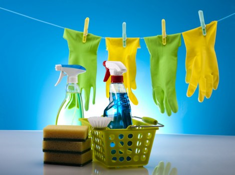 Professional cleaner using PPE while operating extraction equipment
